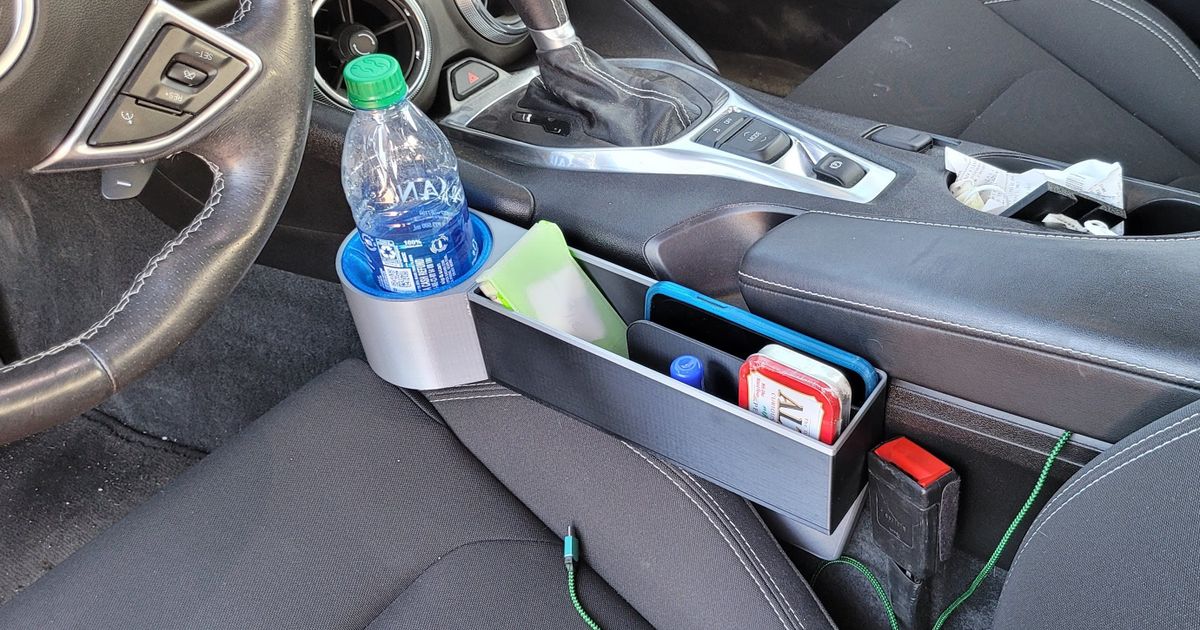 3D printed car seat gap organizer fitted beside a car seat for phones, cards, and small-item storage