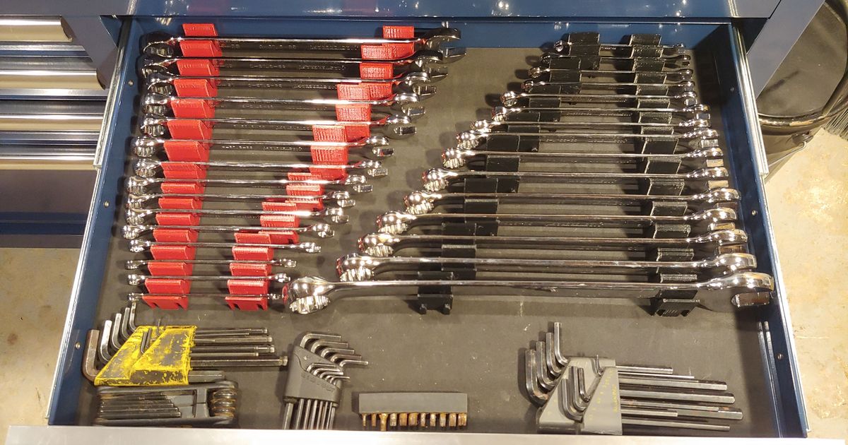3D printed modular tool organizers storing screwdrivers, pliers, and hand tools in a toolbox