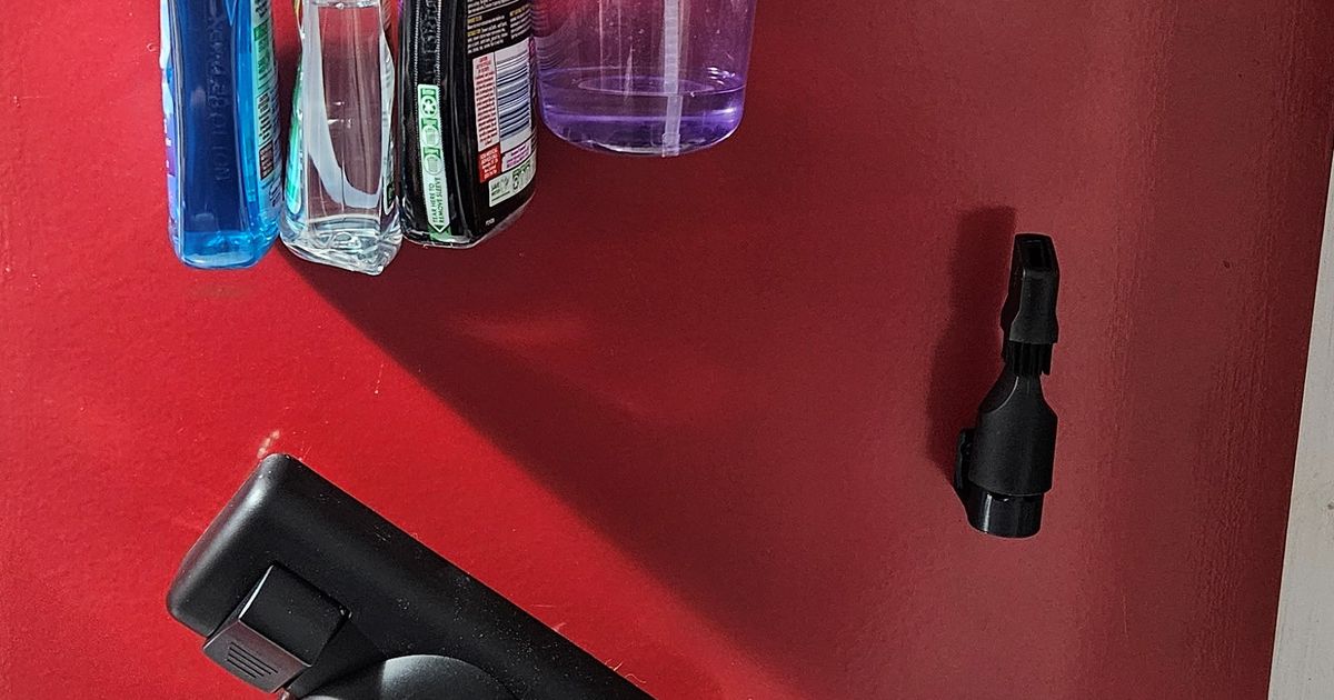 3D printed wall mount for vacuum attachments mounted on a wall for cleaner storage