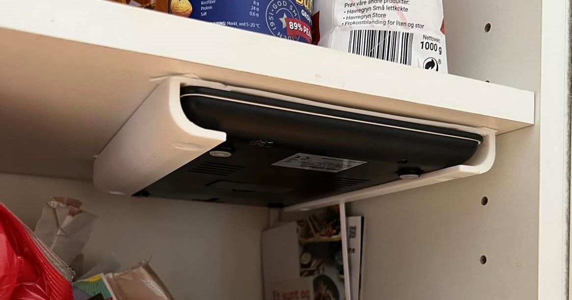 3D printed wall-mounted kitchen scale holder keeping a digital scale off the counter