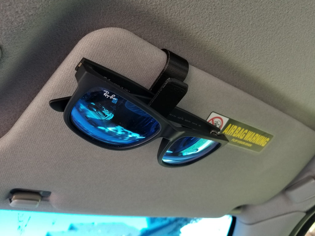 3D printed sunglasses car visor clip mounted on a sun visor for cleaner glasses storage inside a vehicle