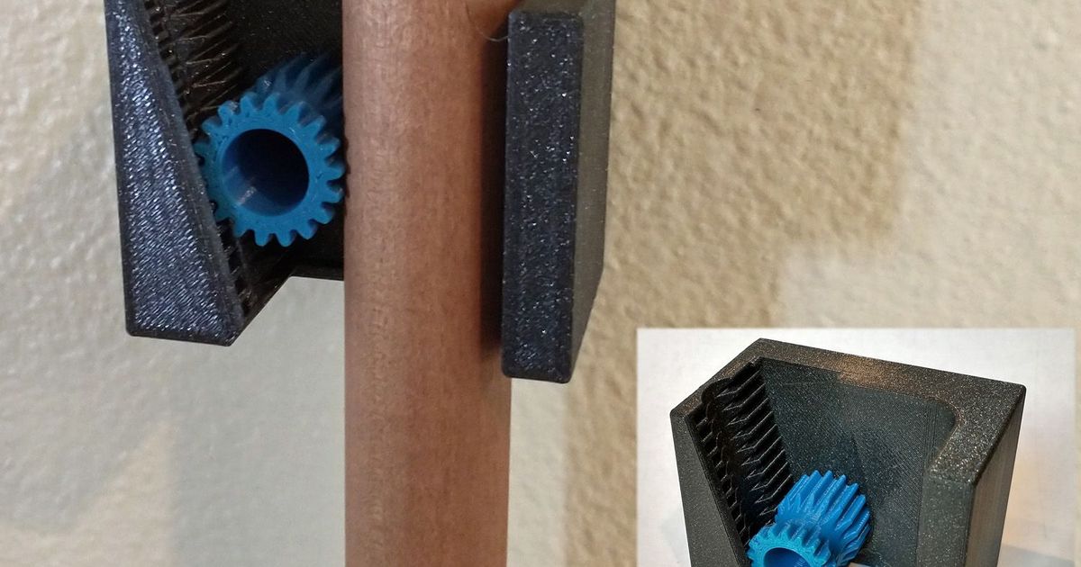 3D printed gravity broom holder mounted on a wall holding long-handle cleaning tools