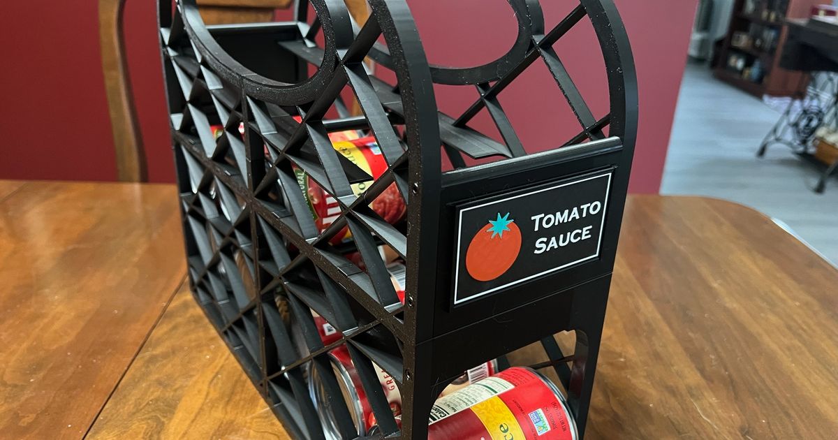 3D printed vegetable can dispenser organizing canned goods in a pantry with labeled front sections