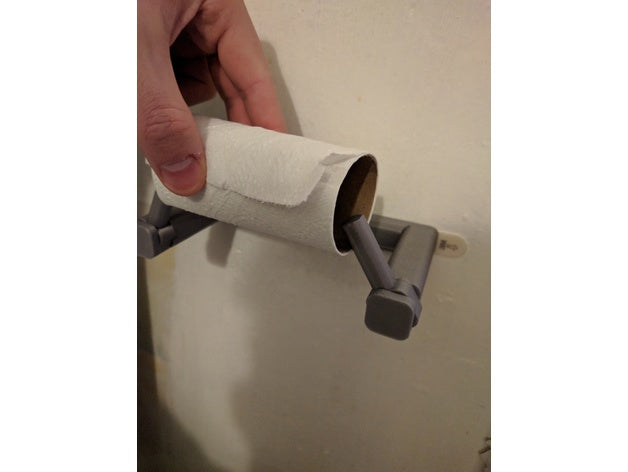 3D printed minimalist quick-change toilet paper roll holder mounted on a wall