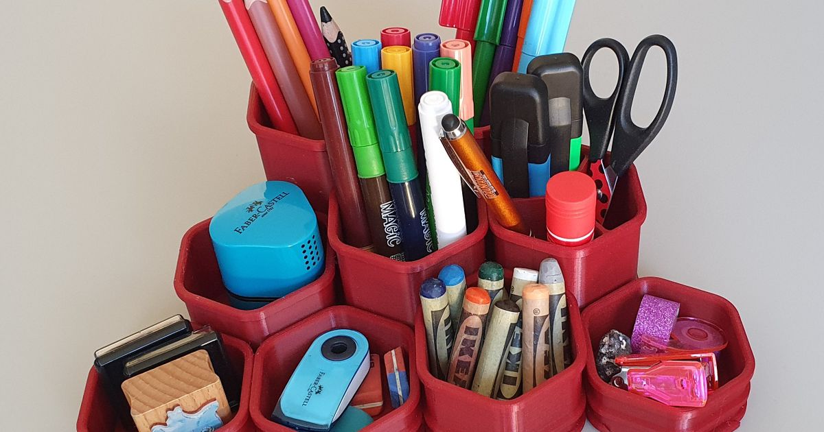 Modular 3D printed desk organizer holding pens, markers, and small desk tools