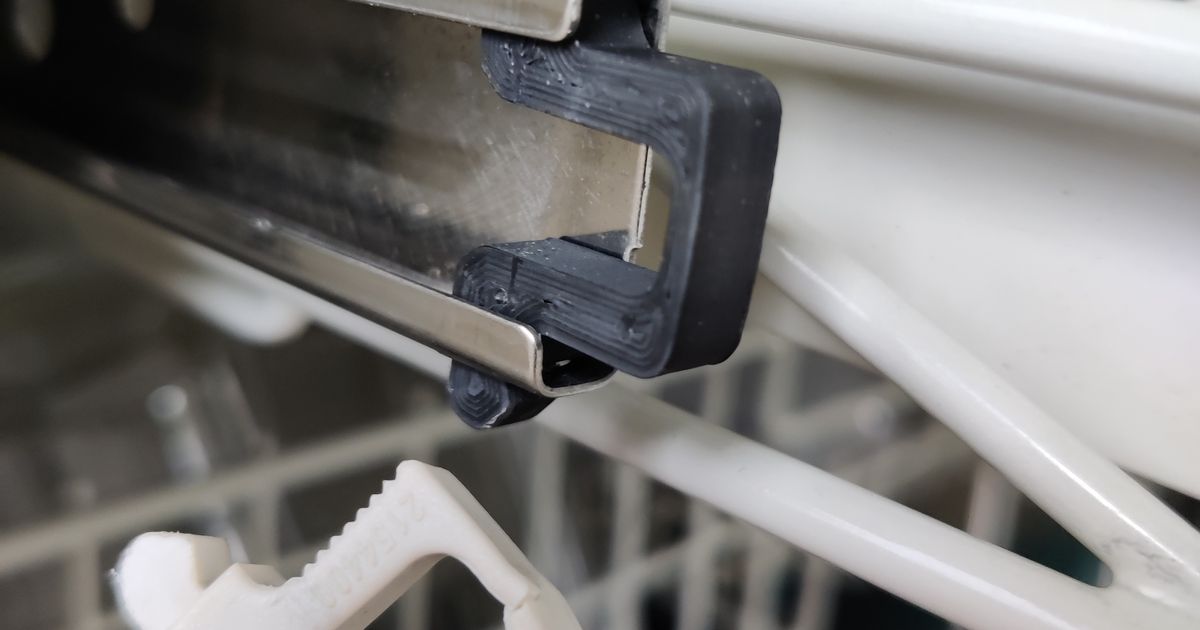 3D printed Miele dishwasher rail clip replacement installed on an upper rack rail