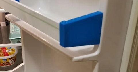 3D printed refrigerator shelf bracket replacement installed inside a fridge