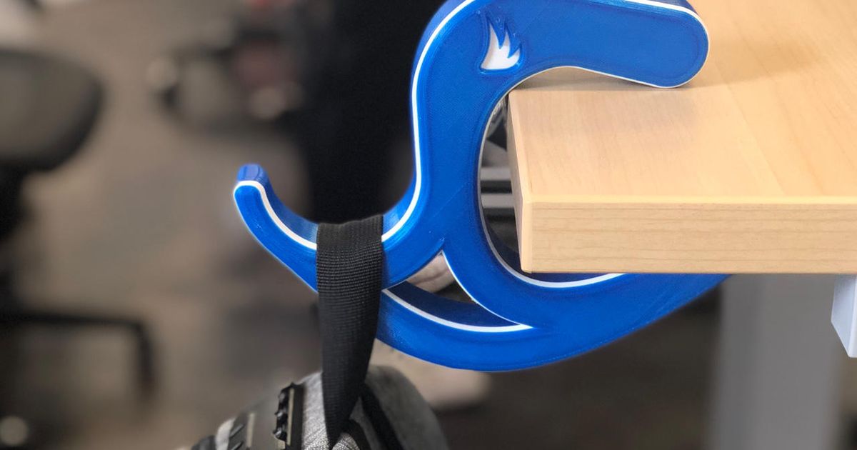 3D printed desk bag hook clipped to a desk edge holding a bag off the floor