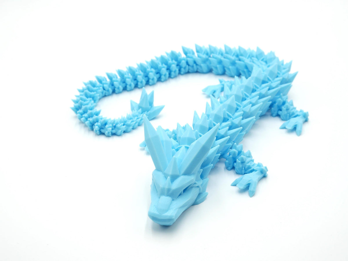 JCSFY articulated light blue ice dragon shown in the Etsy listing hero image