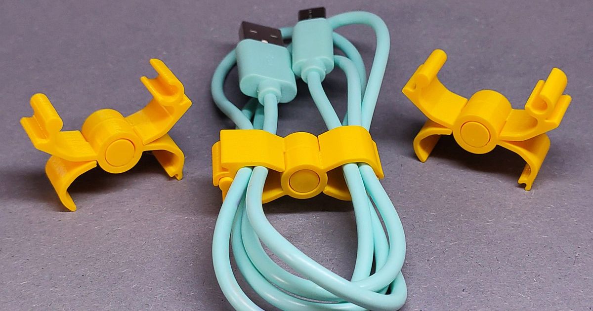 3D printed desk-edge cable clip holding a charging cord in place for cleaner cable routing