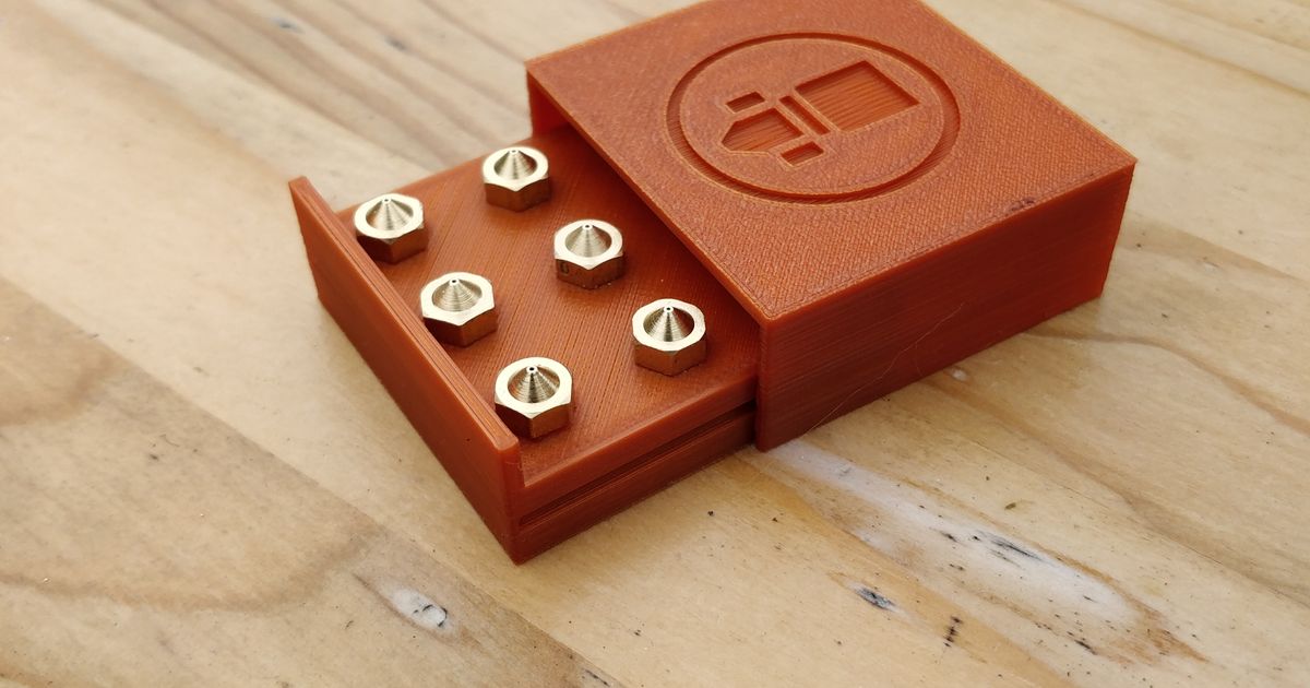 3D printed E3D V6 nozzle holder case with spare nozzles stored in threaded slots