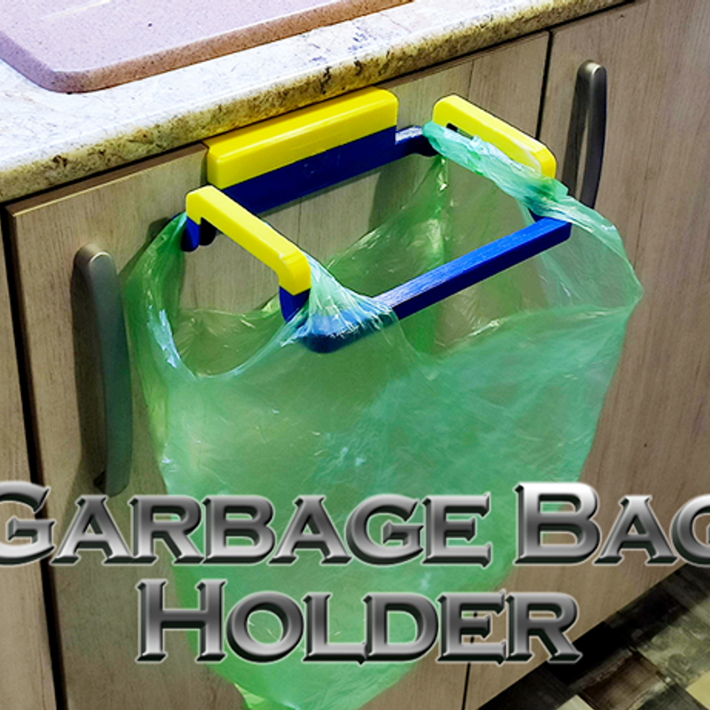 3D printed holder mounted to support a small trash bag for kitchen or workbench cleanup