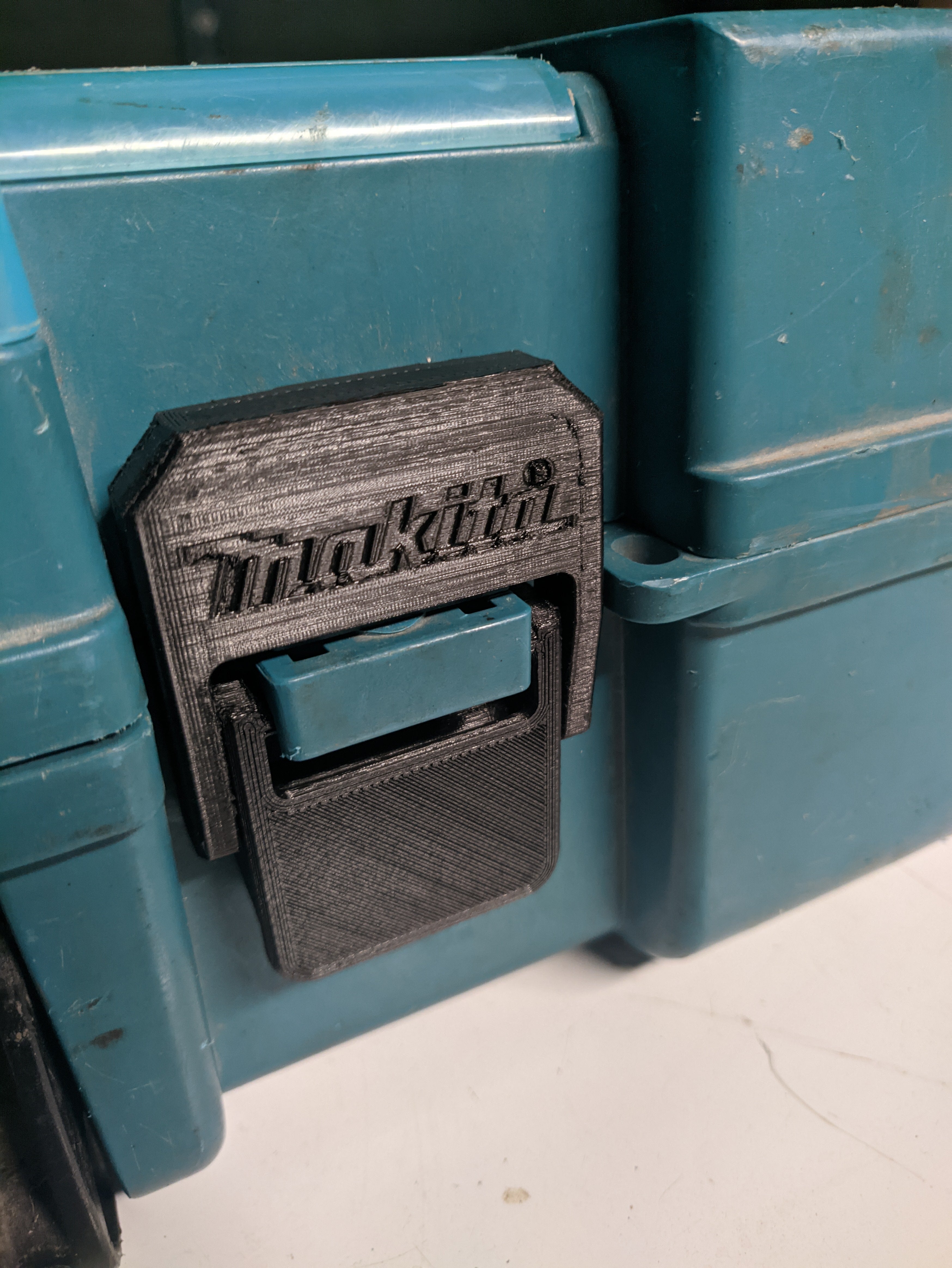 3D printed Makita case latch replacement installed on a cordless tool case