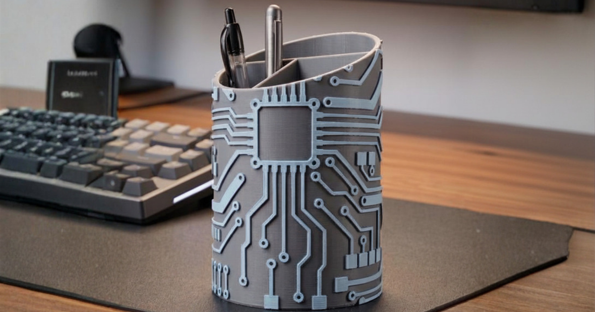 3D printed circuit caddy organizing a breadboard, jumper wires, and small electronics modules