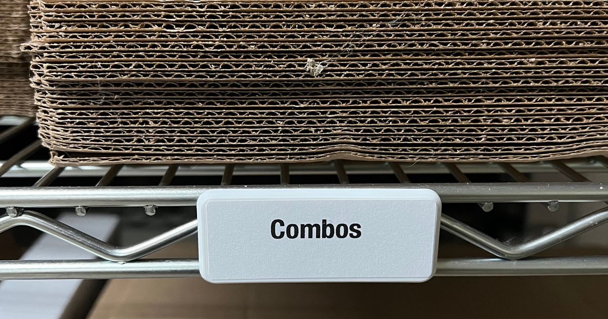 3D printed snap-on label holders attached to metal wire shelving for clearer storage labels