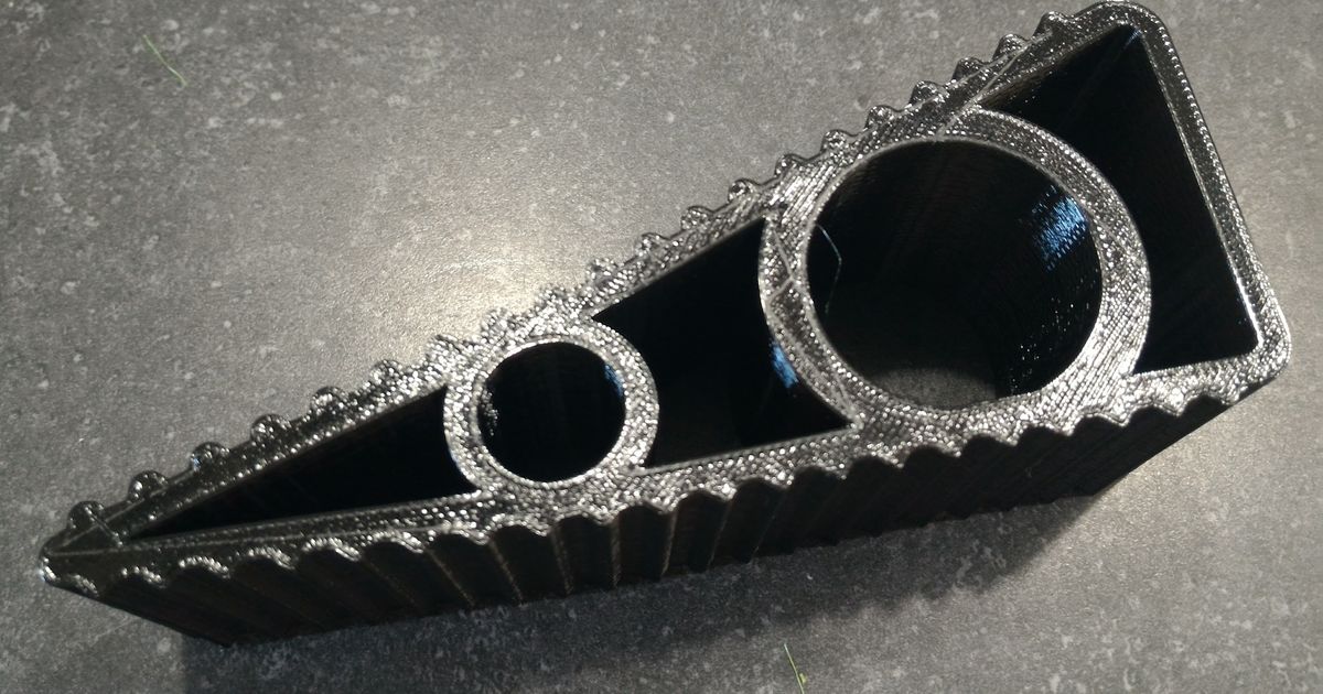 3D printed doorstop wedge holding a door open on the floor