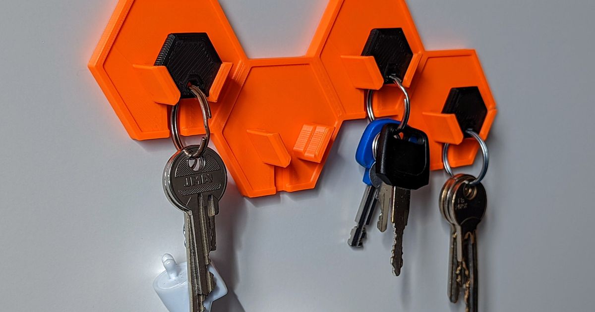 Modern wall-mounted 3D printed key hanger holding keys near an entryway