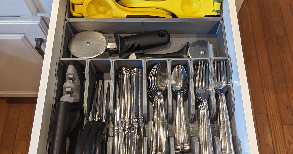 3D printed custom silverware drawer organizer arranged inside a kitchen drawer for forks, spoons, and cutlery