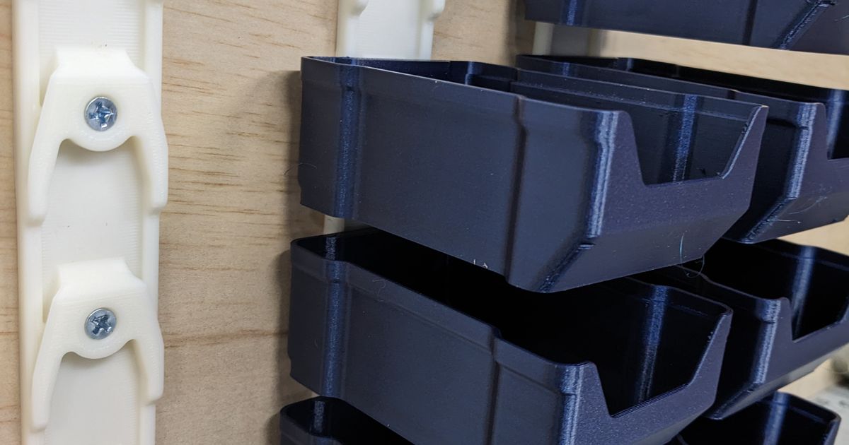 Stackable 3D printed wall-mount storage boxes used for hardware and small parts organization
