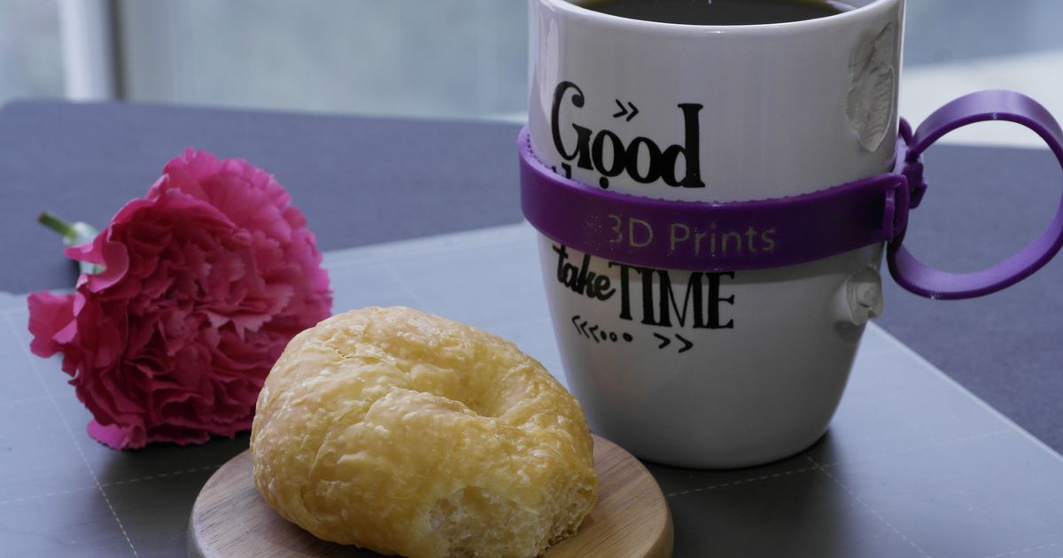 3D printed mug handle repair kit installed on a broken handled mug