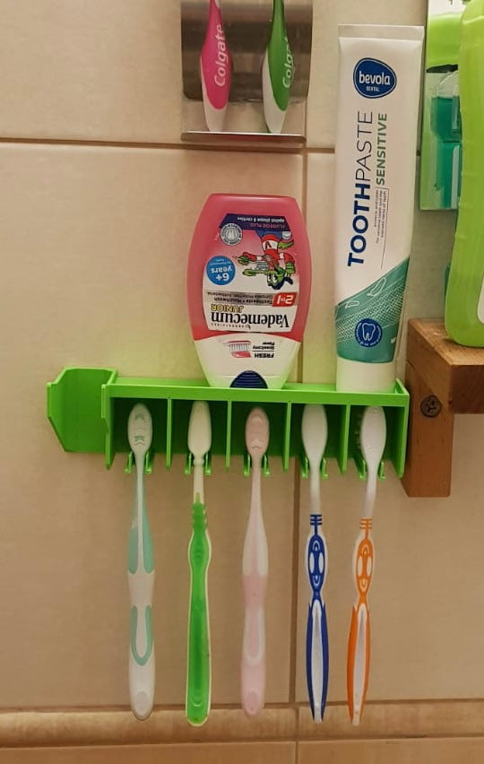 Wall-mounted 3D printed toothbrush holder with separate brush slots and a top shelf for toothpaste